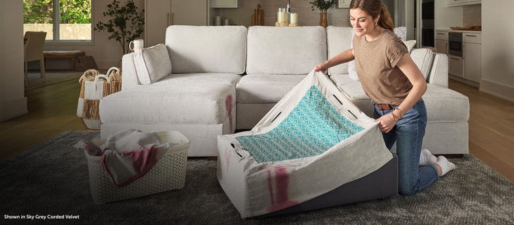 Woman removing her Lovesac sectional couch covers