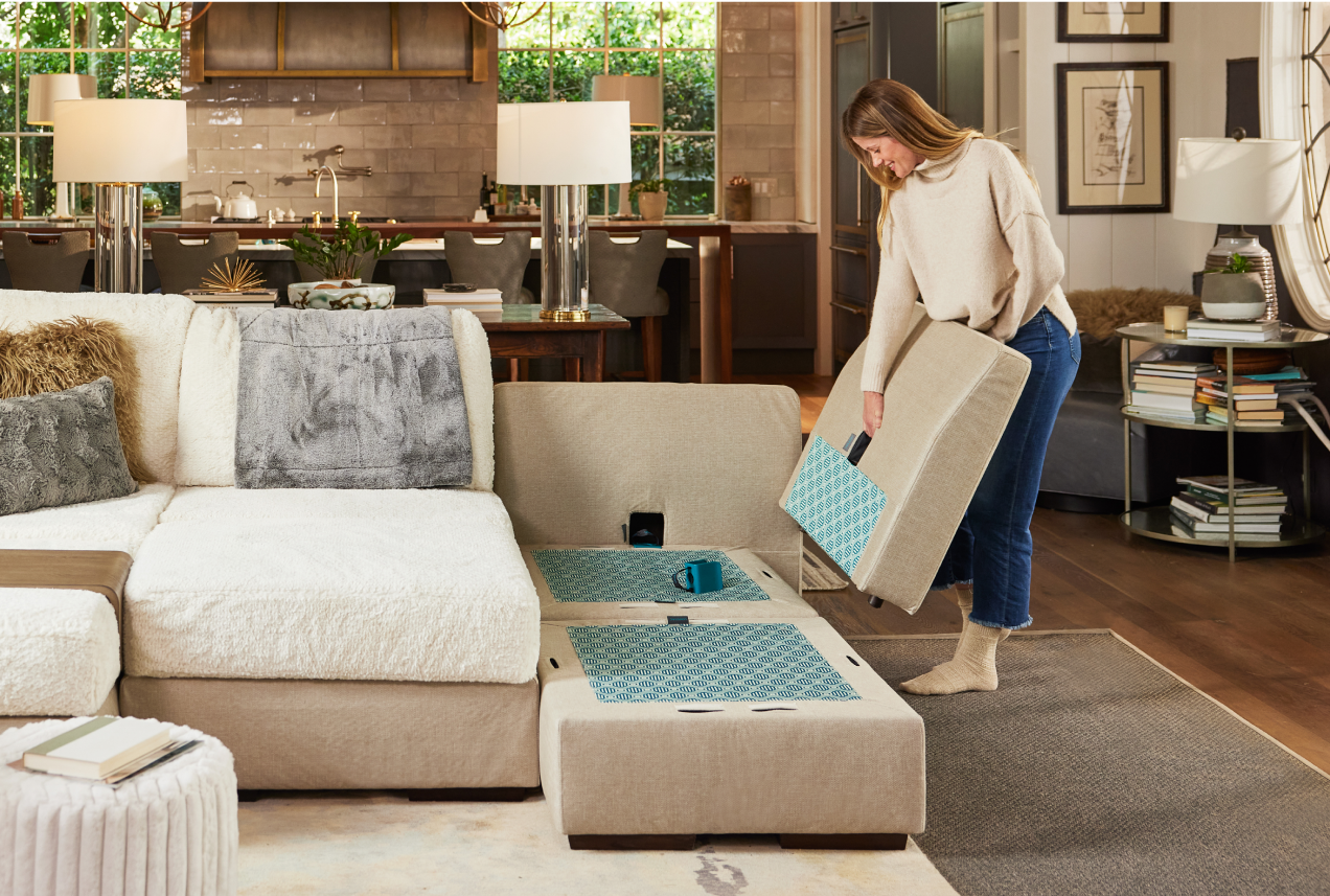 Woman Adding Insert to Lovesac Sactional in Living Room